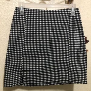 Black and White zip up a-line slit high waisted skirt in good condition.